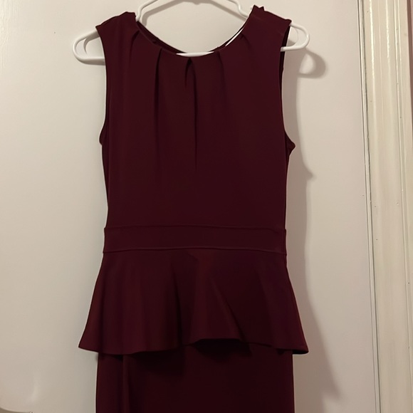 Ricki's Dresses & Skirts - 3/$20.  Burgundy Peplum Dress